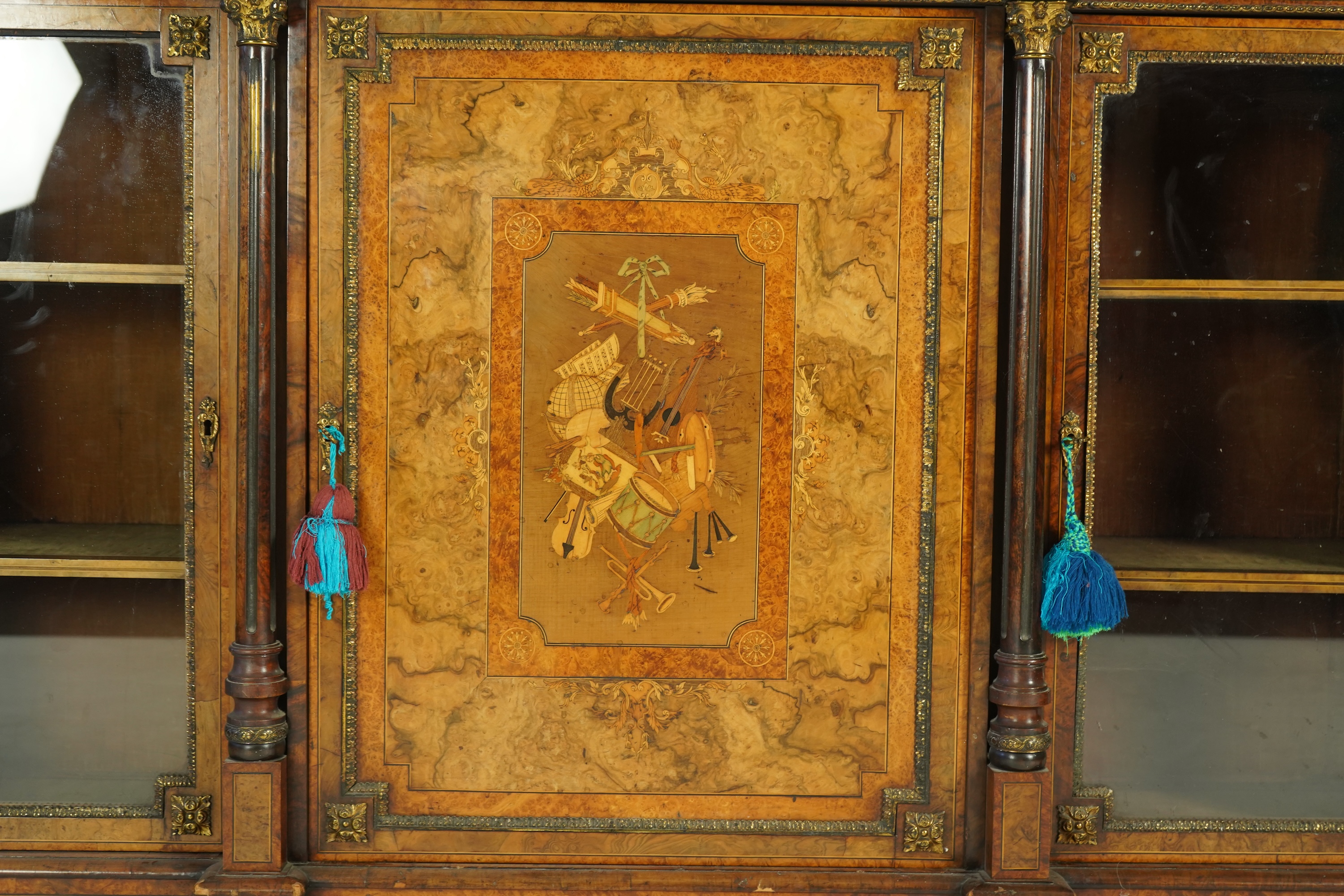 A Victorian birds eye maple banded, gilt metal mounted figured walnut side cabinet